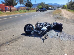 A beat up motorcycle on it's side after being in an accident in Bellflower, California. 