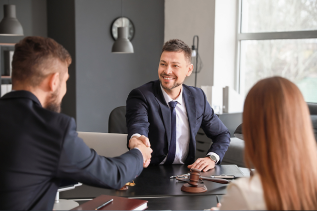 a person meeting with different lawyers to discuss a car accident case.