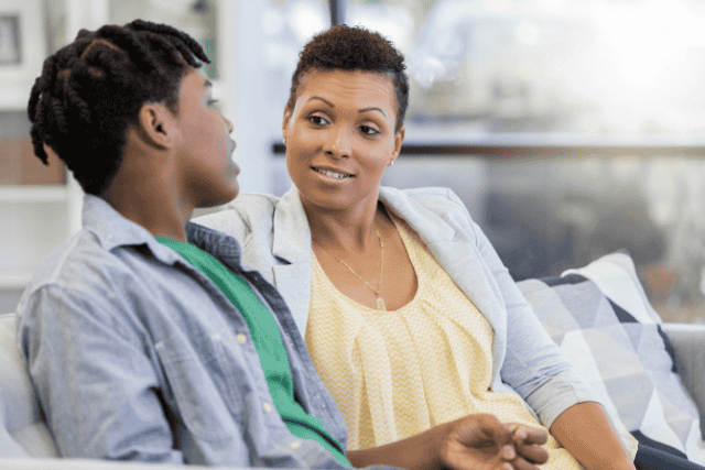 parent supporting and listening to their teen