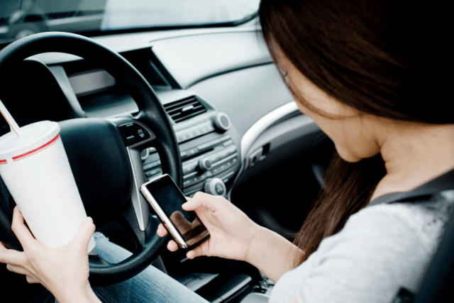 distracted teen driving while on phone
